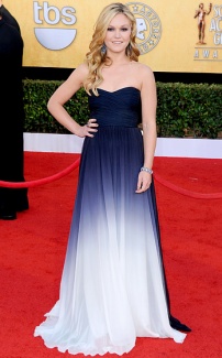 Julia Stiles: Came back to the runway last year looking gorg! Wearing a Monique Lhullier navy and white ombre gown. {Photo: Jon Kopaloff/FilmMagic}