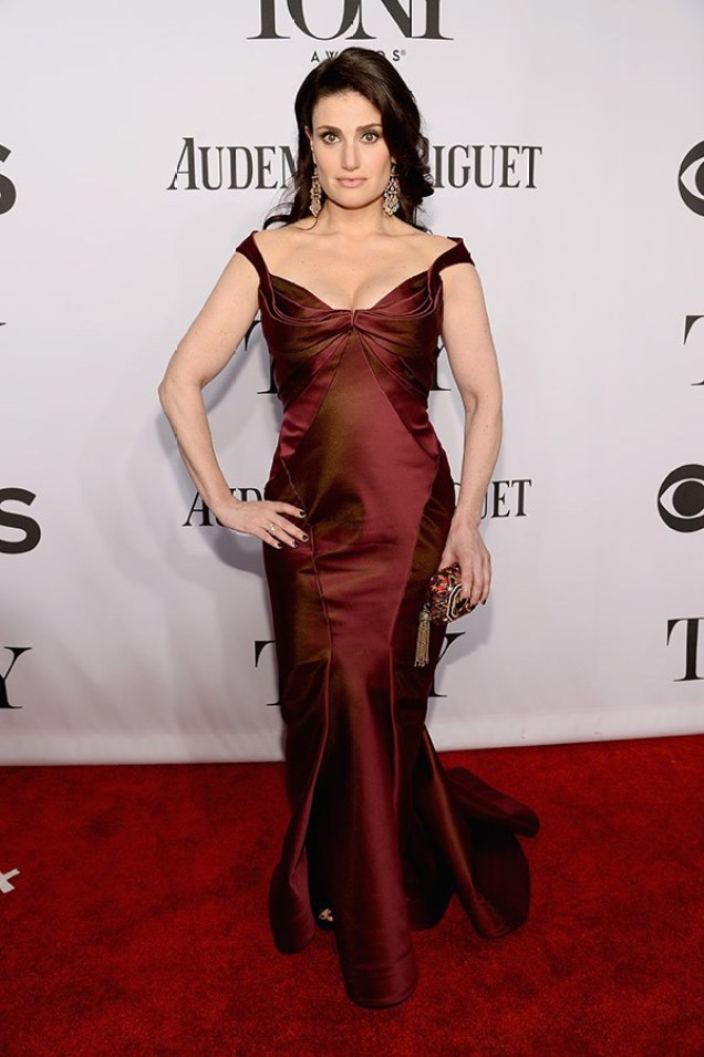 Idinia Menzel in Zac Posen dress, Jimmy Choo heels, a Judith Leiber clutch, Jacob & Co. earrings, and a Forevermark ring, arriving at the 2014 Tony Awards.