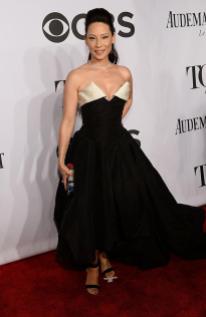 Lucy Liu in Vivienne Westwood gown, Nicholas Kirkwood shoes, a Judith Leiber bag, and Lorraine Schwartz jewelry, arrives at the 2014 Tony Awards Red Carpet.