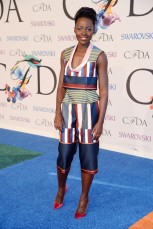 Lupita Nyong’o in custom Suno top and pants; Jennifer Fisher jewelry; Sophia Webster Coco pumps.